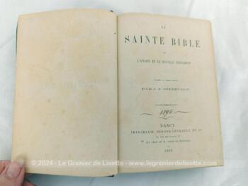 Datée de 1893, voici le livre "La Sainte Bible  ou L'Ancien Testament et le Nouveau Testament" d'après la version revue par J.F. Osterwald. avec reliure cartonnée sur 1071 pages